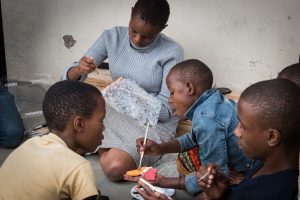 Butterly Project - kids painting butterflies at their orphanage